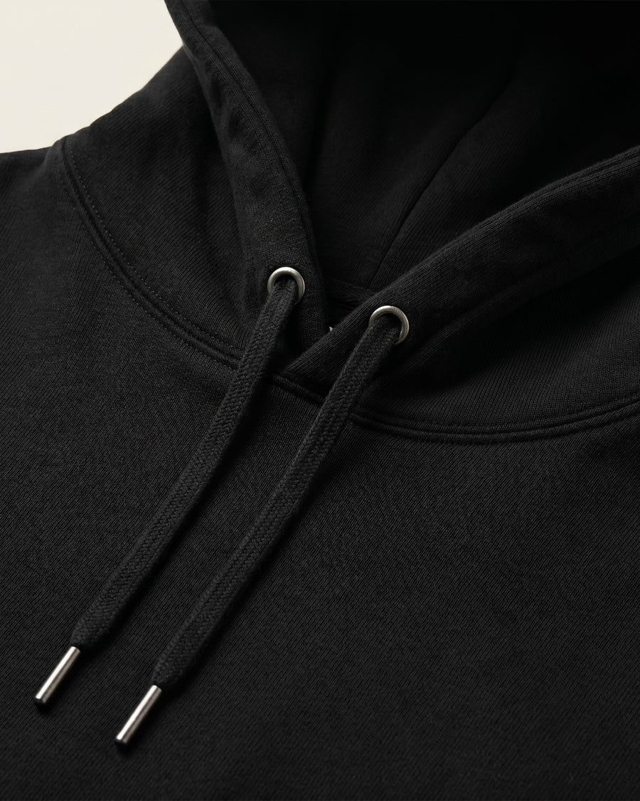 Hood close-up: Detail of the heavyweight black hood and drawcords on the Seeking Victory Gold Edition hoodie. - image 4