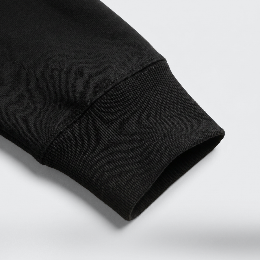 Cuff: close-up of the ribbed cuff showing the dense, substantial black fleece. - image 5