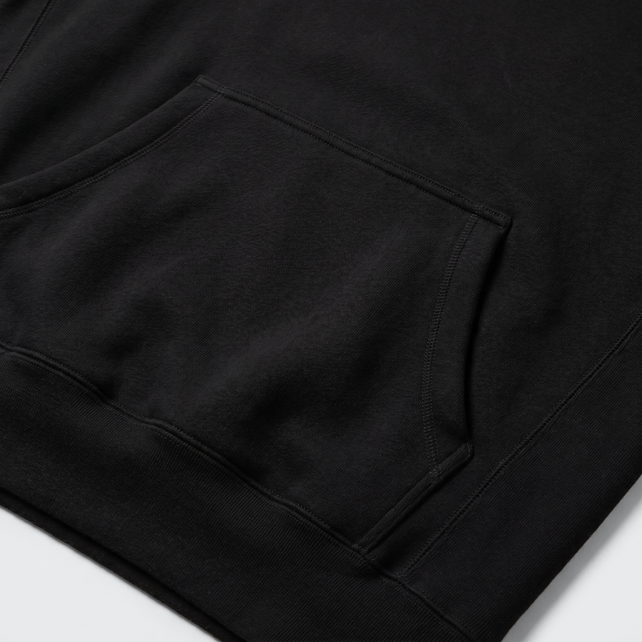 Pocket: detail of the front pouch pocket on the heavyweight black hoodie. - image 6