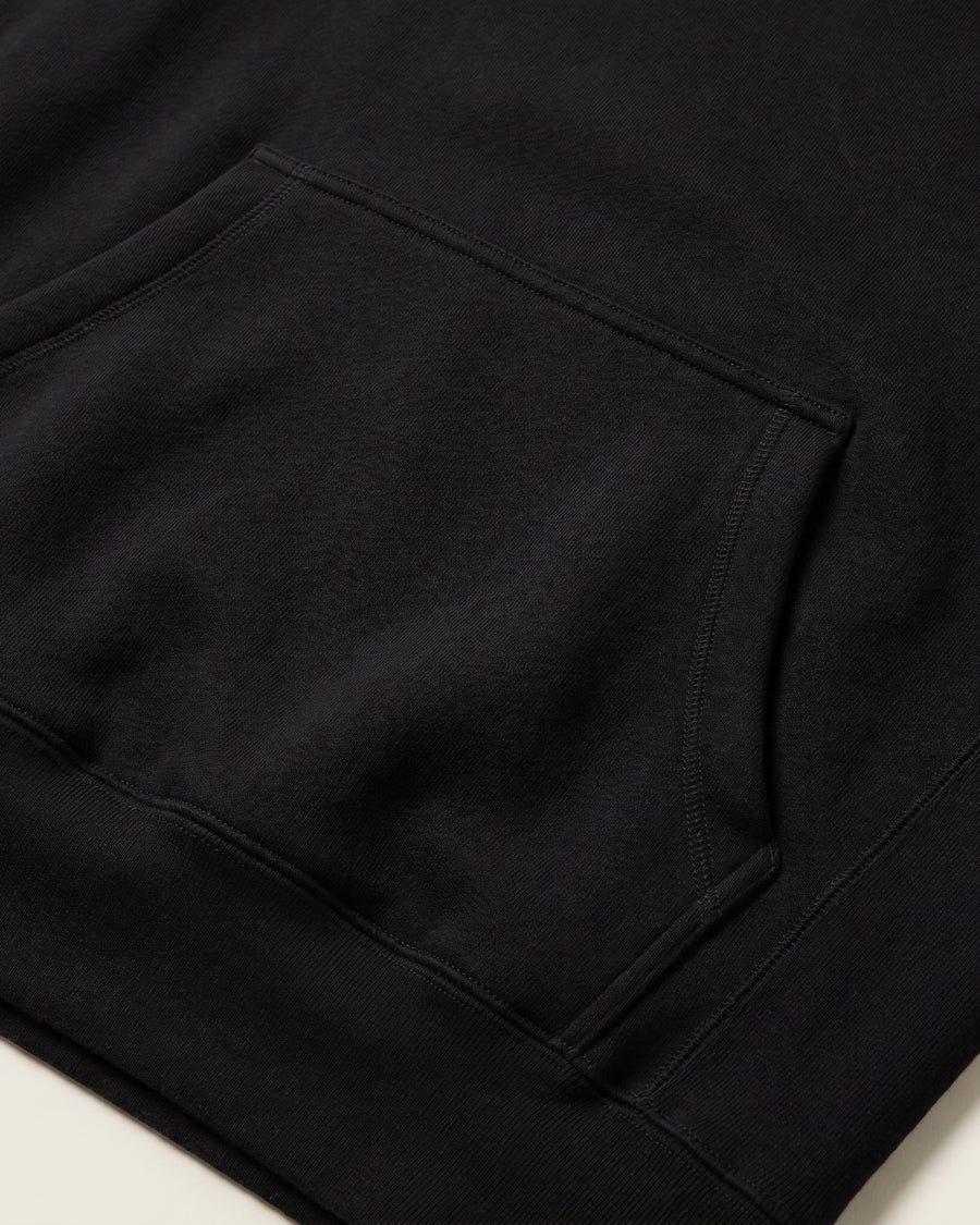 Pocket: Detail of the front pouch pocket on the heavyweight black hoodie. - image 6