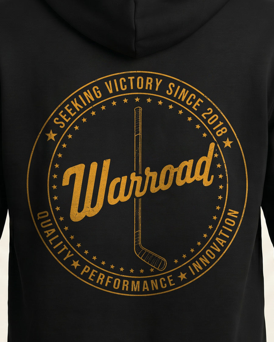 Back-crest close-up: Macro of the gold "Seeking Victory Since 2018" back crest — hockey stick centered inside the star ring. - image 7