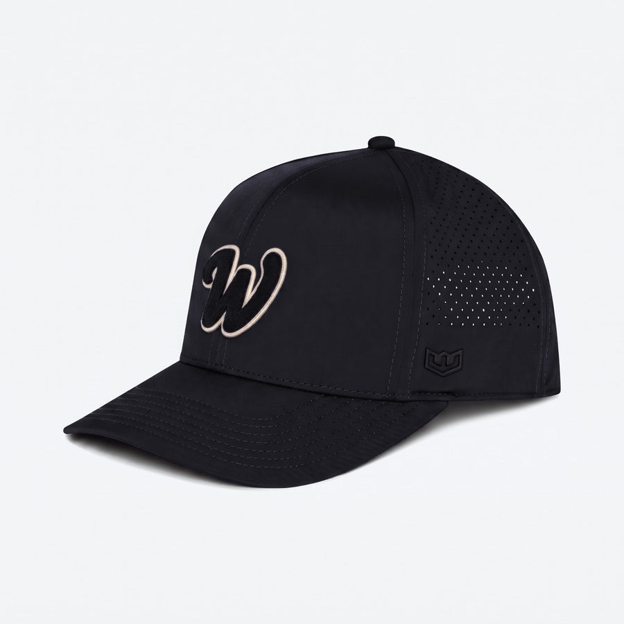 Warroad W Series Hat in black, three quarter view showing the laser perforated rear panels - image 2