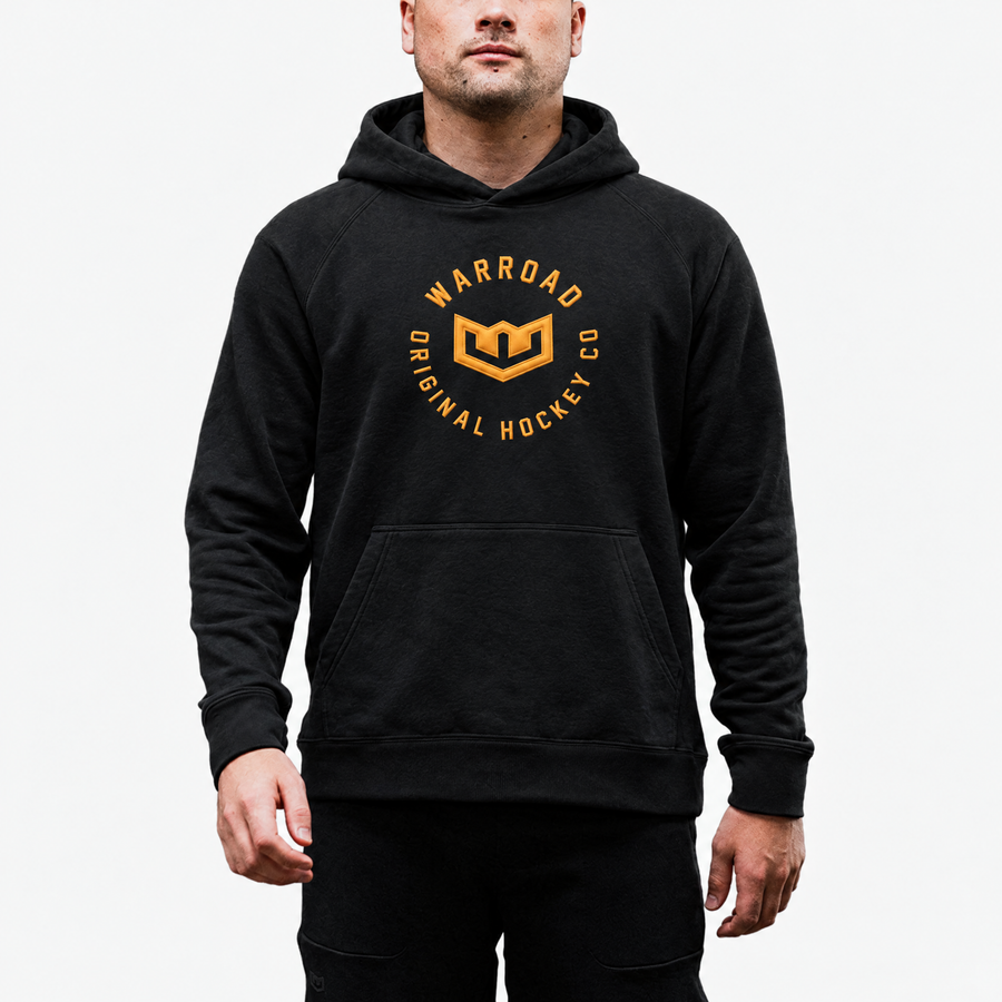 Crest Pullover Hoodie in Black worn, arms crossed - image 4