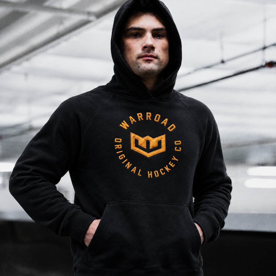 Crest Pullover Hoodie in Black worn with hood up - image 2